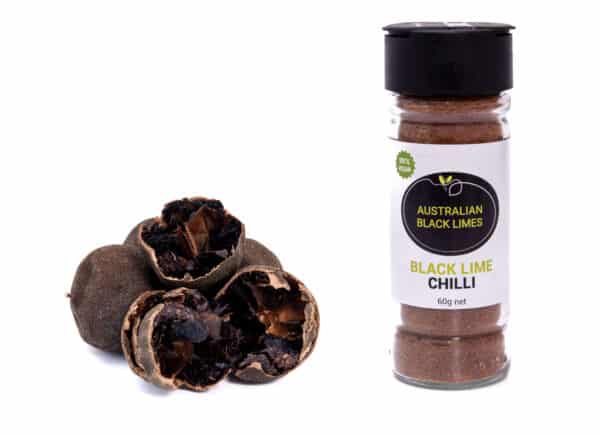 Australian Black Lime Chilli salt with black limes next to the shaker